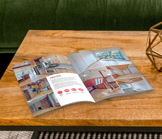 Shirriff Wells listing booklet open on a table.