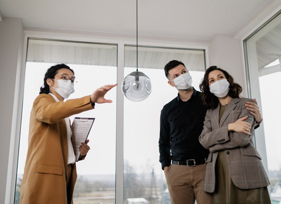 Couple looking at home for sale with realtor