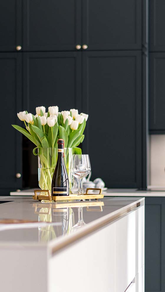 Celebratory champange and flowers on a kitchen island after moving to Toronto.